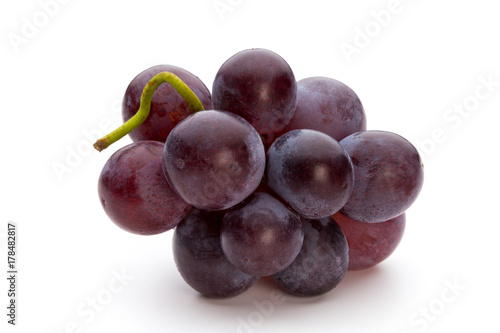 Ripe red grape isolated on white.