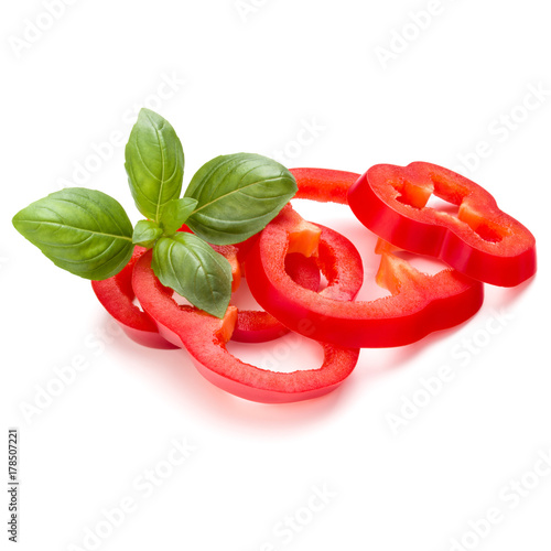 Red sweet bell pepper slices and basil leaves isolated on white background cutout