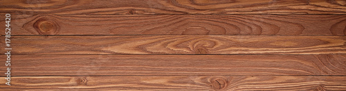 Wooden background with copyspace, brown striped timber desk, old table or floor