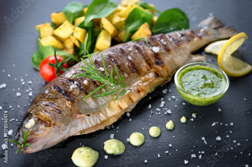 Grilled trout with potato and spinach