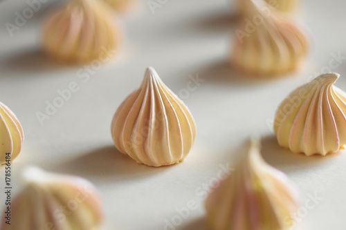 Many yellow Meringue, on white background.