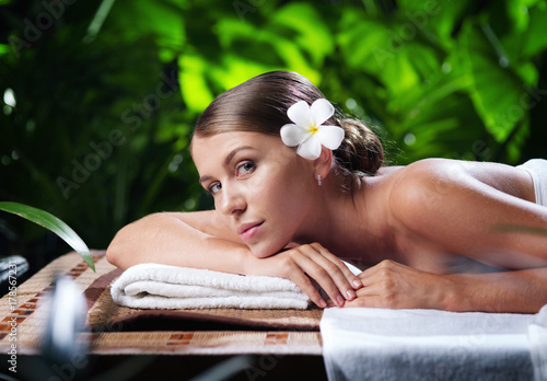 portrait of young beautiful woman in spa environment.  