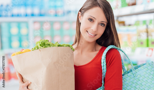 Woman buying fresh vegetables
