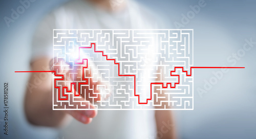 Businessman searching solution of a complicated maze