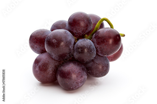 Ripe red grape isolated on white.