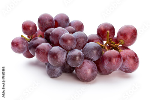 Ripe red grape isolated on white.