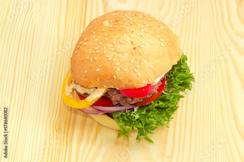Traditional hamburger on a wooden surface