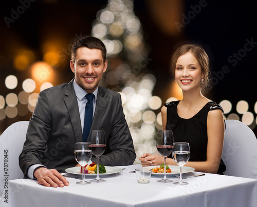 couple at served restaurant table at christmas