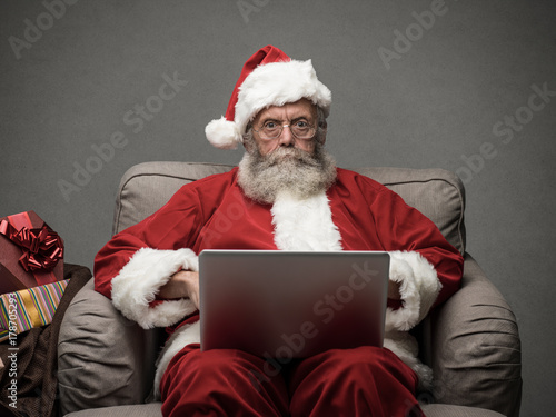 Santa Claus connecting with a laptop