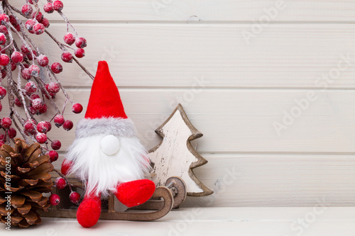 Christmas decor on the wooden white background.