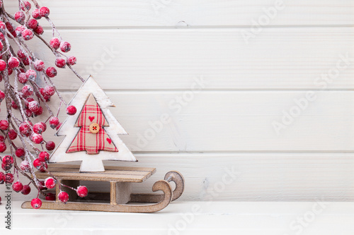 Christmas decor on the wooden white background.