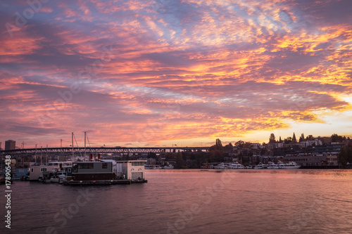 Colorful clouds light up the sky over Lake Union on a fall morning