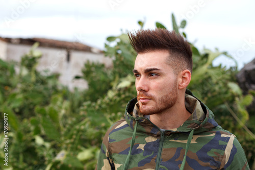 Attractive guy with military jacket