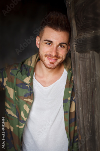 Atractive guy with jacket with military stylish