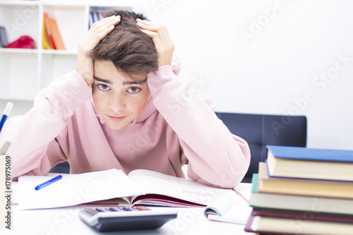 young teenager on the desk studying