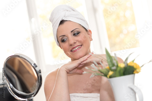 Portrait of pretty young woman in bathroom