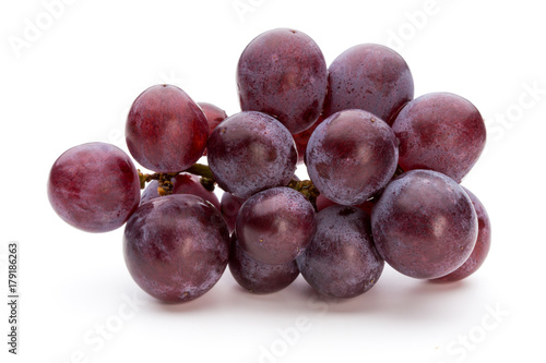 Ripe red grape isolated on white.