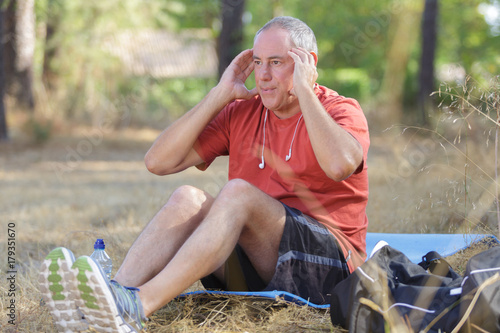 elderly man doing abs exercises