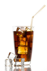 Glass of cola with ice cubes and straw on white background