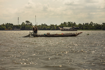 Fishermen on the Mekong river