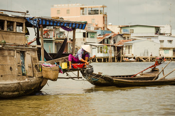 Woman getting water from a river