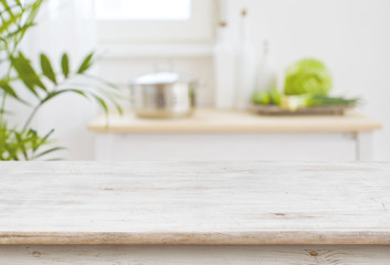 Table top and blurred kitchen room as background