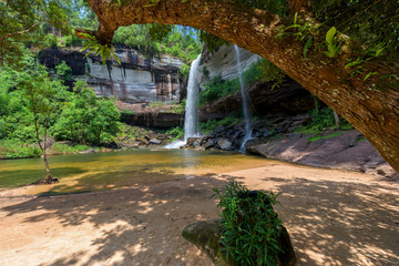 Beautiful Huay Luang waterfall in green forest in jungle, Ubon Ratchathani, Thailand.