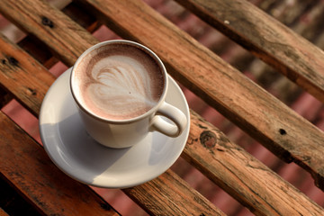 A cup of coffee on wooden