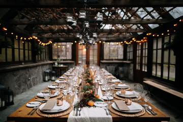 Set tables for fancy dinner in a green house