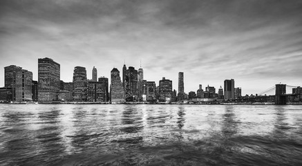 Black and white panoramic picture of the Manhattan skyline at dusk, New York City, USA.