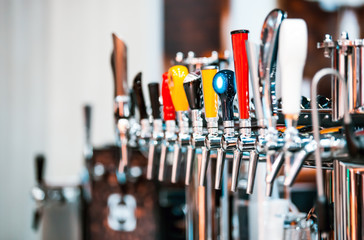 Different types of beer cranes in pub