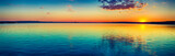 Sunset over the lake. Amazing panorama landscape