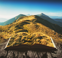 Mountain valley on the pages of an open book