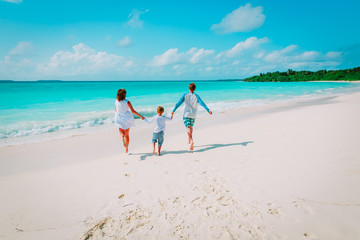 happy family with kid play run on beach