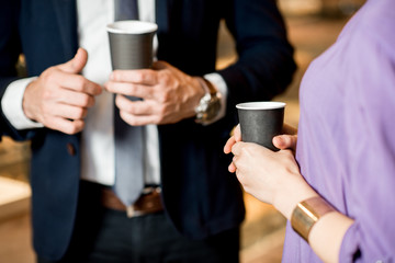Business people with coffee cups