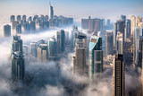 Dubai skyline, an impressive aerial top view of the city in Dubai Marina on a foggy day