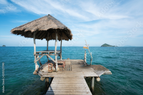 Фото: Wooden pier and hut in Phuket, Thailand. Summer, Travel, Vacation and Holiday concept. Wooden pier and hut in Phuket, Thailand. Summer, Travel, Vacation and Holiday concept.