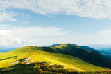 View of the stony hills glowing by evening sunlight. Dramatic spring scene. Chornohora ridge, Carpathians, Ukraine, Europe.