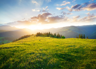 Sunset in the mountain valley. Beautiful natural landscape in the summer time