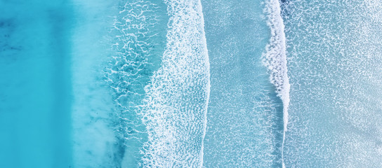 Wave on the beach as a background. Beautiful natural background at the summer time