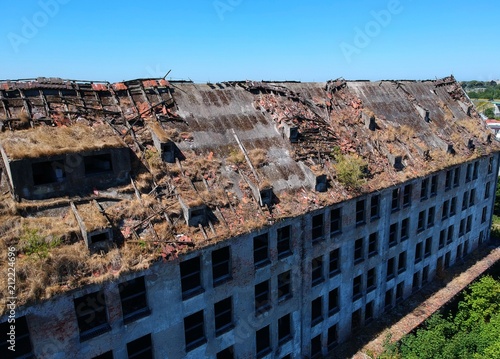 Фото: Old destroyed and ruined industrial building, aerial view Old destroyed and ruined industrial building, aerial view