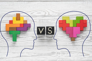 Heart vs Mind. Heart versus brain. Concept of mind against love.