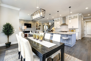 Beautiful kitchen in luxury modern contemporary home interior with island and chairs