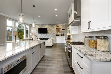 Beautiful kitchen in luxury home modern  interior with island and stainless steel chairs