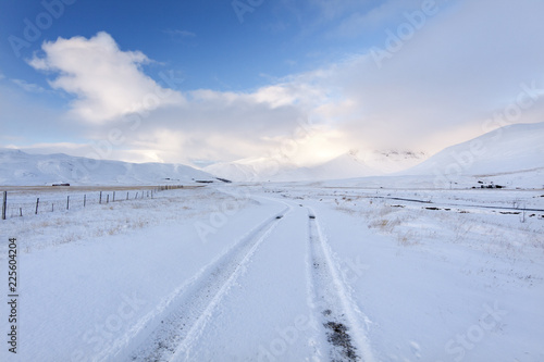 Zdjęcie XXL Lonely winter road./ Amazing landscape with country road, mountains and snow in south Iceland