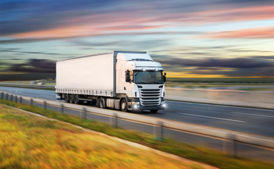 Truck with container on road, cargo transportation concept.