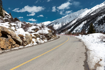highway through mountain with snow at winter