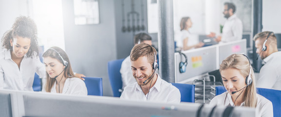 Call center worker accompanied by his team.