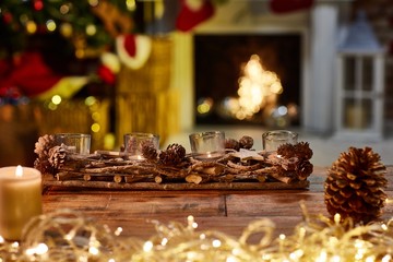 Christmas still life with candles and fireplace