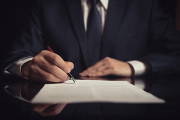 Lawyer, attorney signing a contract